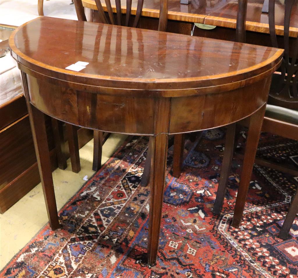 A George III mahogany demi-lune tea table